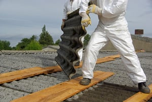 construction worker removing asbestos