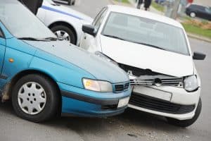 Car collision on a city road or highway.