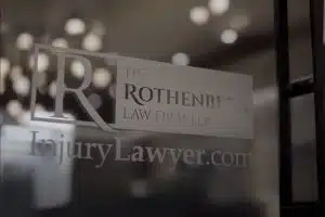 The Rothenberg Law Firm Accident and Injury Lawyers logo on glass